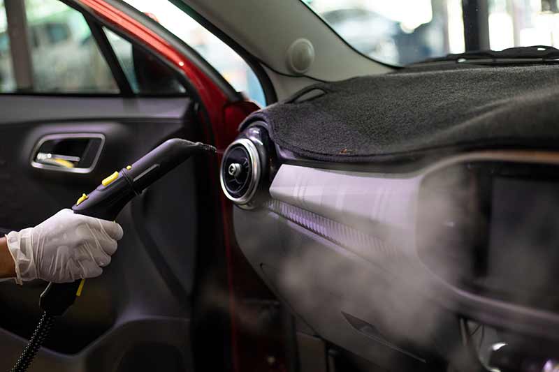 cleaning car with steam