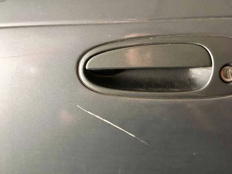 bare metal scratch on car door